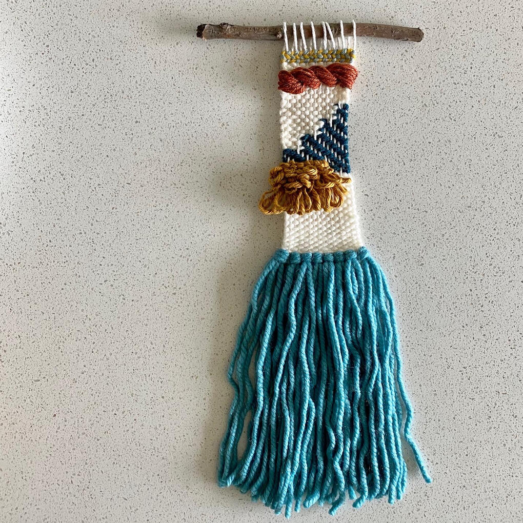 Blue, white, and ochre weaving.